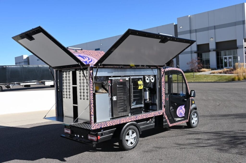 image of clubcar urban EV used on a campus | campus dining electric vehicles